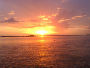 A warm tropical sunset over the water — a Southwest Florida winter evening