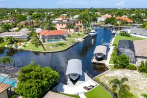 A powerboat docked behind a Cape Coral gulf-access canal home